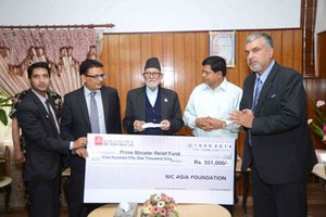 NIC-Asia Bank handed over the check for flood victims