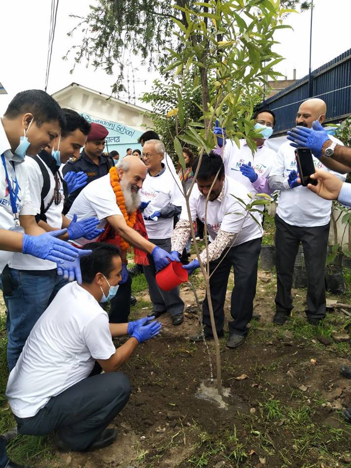 Ambassador along with Prinicipal of the School and Shalom Club members Planting.jpg