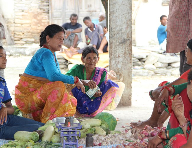 Bindra Devi Saud of Nawathana, Achham selling her farm produces at Haat Bazar.jpg