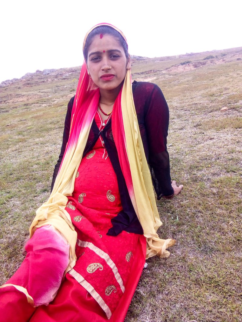 Dhana Bhatt taking a rest outside her home.jpg