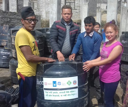 Distribution of water tank to Kancha Tamang Ward Chair of Naukunda Municipality-1 at Naukunde Langhu Village.jpg
