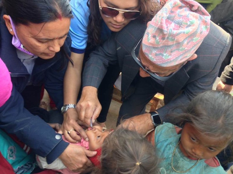Dr. Pande Adminsitring Polio Mission.jpg