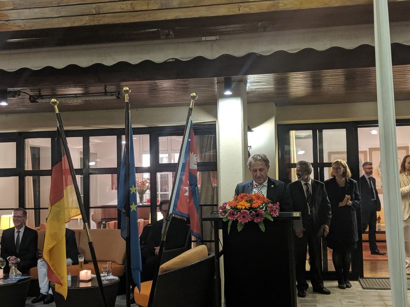 German Minister Addressing the program.jpg