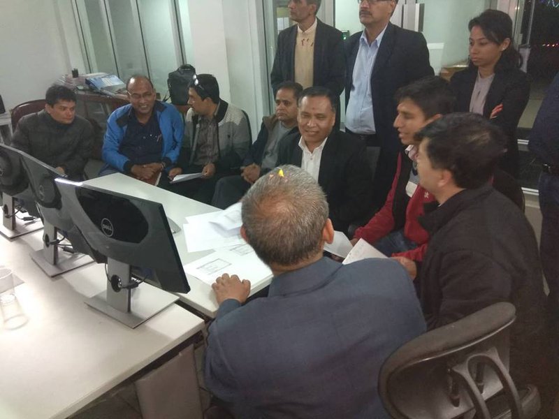 Ghising with his colleagues.jpg