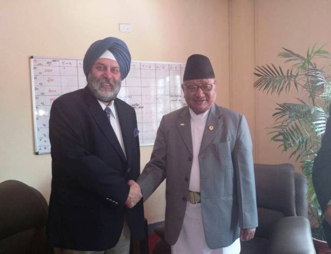 Indian ambassador Puri with Minister of Education Gopal Man Shrestha.jpg