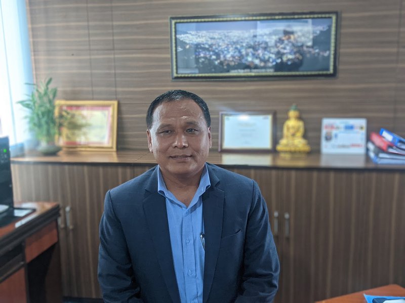 Kul Man Ghising 2023 August at his office.jpg