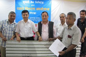 Kumari Bank Distributes Galvanized Sheets For Schools at Gorkha