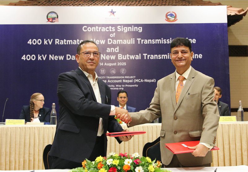 MCA-Nepal ED exchanging the contract with Angelique-Skipper JV.jpg