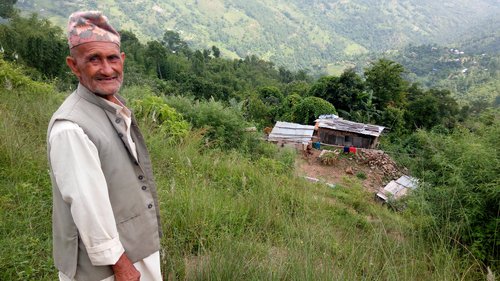 Mahendra Bdr Ghimire of Dhankuta shows his destroyed house.jpg