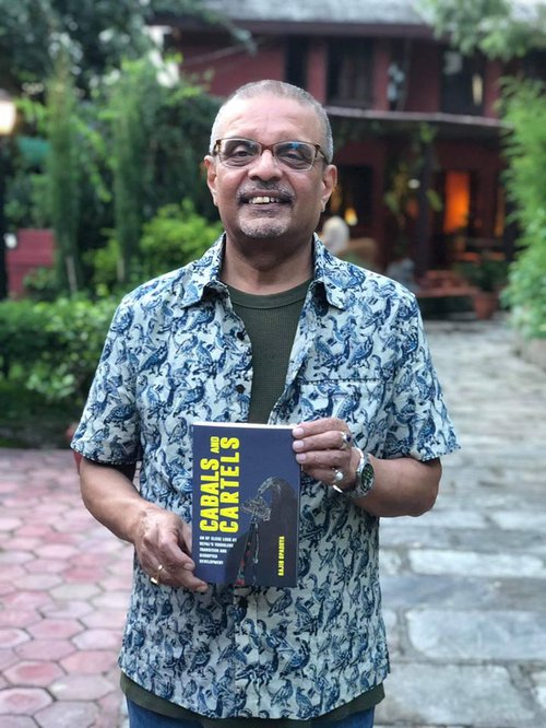 Rajib with his book.jpg