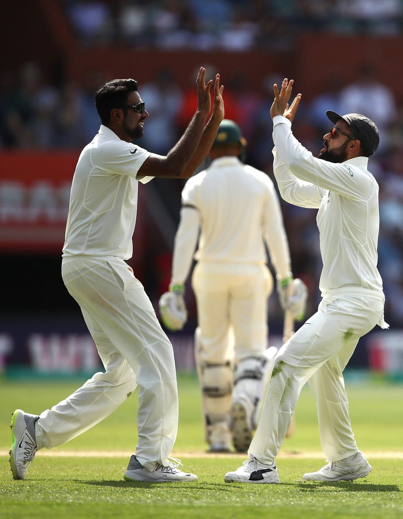 Virat-Kohli-celebrates-with-his-team-mates.jpg